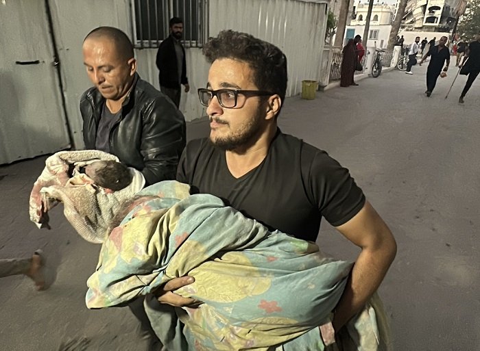 GAZA CITY, GAZA - OCTOBER 26: (EDITORS NOTE: Image depicts death) The body of a Palestinian baby who killed in Israeli attack on house of the Makot family in the Sheikh Ridwan neighborhood, is brought to Al-Ahli Baptist Hospital in Gaza City, Gaza on October 26, 2024. ( Hamza Z. H. Qraiqea - Anadolu Agency )