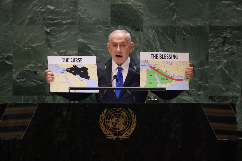 Israeli Prime Minister Benjamin Netanyahu holds maps as he speaks during the 79th Session of the United Nations General Assembly at the United Nations headquarters in New York City on September 27, 2024. Israeli Prime Minister Benjamin Netanyahu said at the UN Friday that operations against Hezbollah will continue, dampening hopes of a 21-day truce proposed by France and the United States this week. (Photo by Charly TRIBALLEAU / AFP) (Photo by CHARLY TRIBALLEAU/AFP via Getty Images)