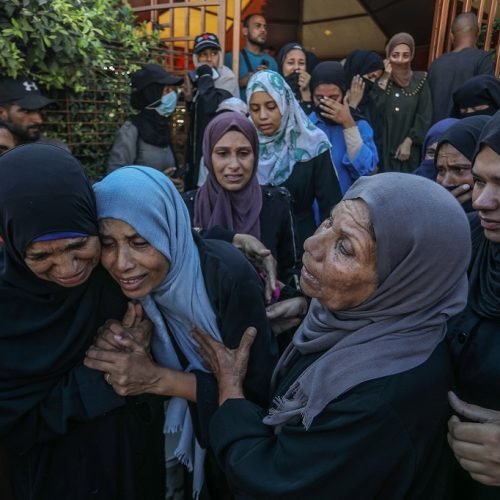 KHAN YUNIS, GAZA - AUGUST 2: Relatives of Palestinians, who lost their lives following the Israeli attacks on tents housing displaced people in the Asdaa area, mourn as the bodies are brought to Nasser Hospital for funeral process in Khan Yunis, Gaza on August 2, 2025. ( Abed Rahim Khatib - Anadolu Agency )