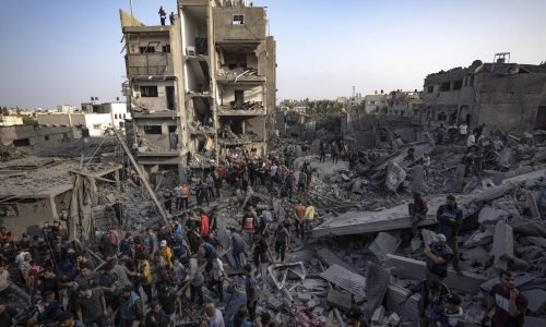 Palestinians look for survivors of the Israeli bombardment in the Maghazi refugee camp in the Gaza Strip, Sunday, Nov. 5, 2023. (AP Photo/Fatima Shbair)