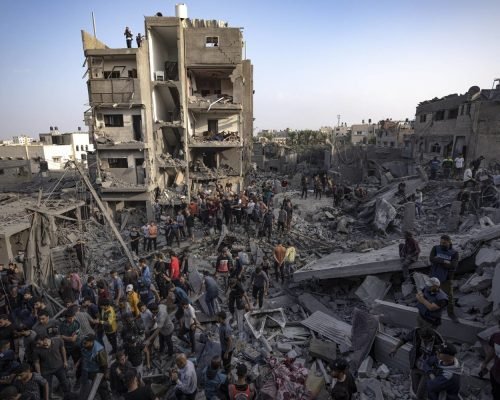 Palestinians look for survivors of the Israeli bombardment in the Maghazi refugee camp in the Gaza Strip, Sunday, Nov. 5, 2023. (AP Photo/Fatima Shbair)