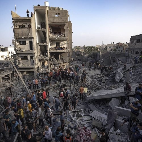 Palestinians look for survivors of the Israeli bombardment in the Maghazi refugee camp in the Gaza Strip, Sunday, Nov. 5, 2023. (AP Photo/Fatima Shbair)