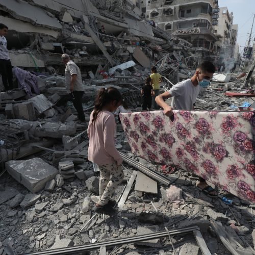 Palestinians inspect the ruins of Aklouk Tower destroyed in Israeli airstrikes in Gaza City on October 8, 2023. The death toll from the devastating Israeli war on the Gaza Strip has risen to 313 since early yesterday morning, with more than 1,990 others injured, according to medical sources. Photo by Naaman Omar apaimages