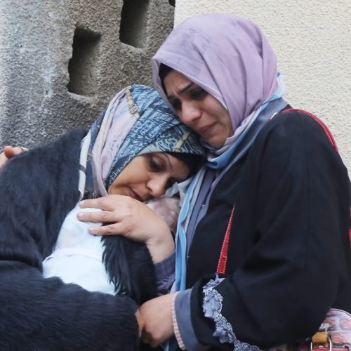 Relatives of the Palestinians died in Israeli attacks, mourn as they receive the dead bodies from the morgue of Al-Aqsa Hospital for burial in Dair El-Balah, Gaza Strip, 18 February 2024. Photo by Omar Ashtawy apaimages