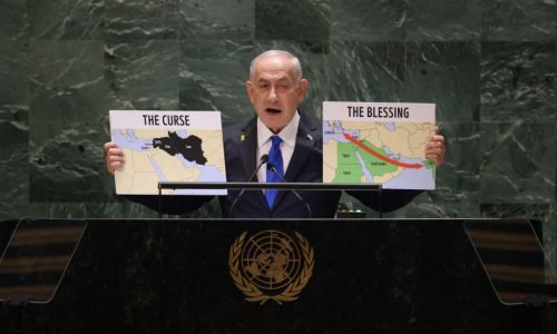 Israeli Prime Minister Benjamin Netanyahu holds maps as he speaks during the 79th Session of the United Nations General Assembly at the United Nations headquarters in New York City on September 27, 2024. Israeli Prime Minister Benjamin Netanyahu said at the UN Friday that operations against Hezbollah will continue, dampening hopes of a 21-day truce proposed by France and the United States this week. (Photo by Charly TRIBALLEAU / AFP) (Photo by CHARLY TRIBALLEAU/AFP via Getty Images)