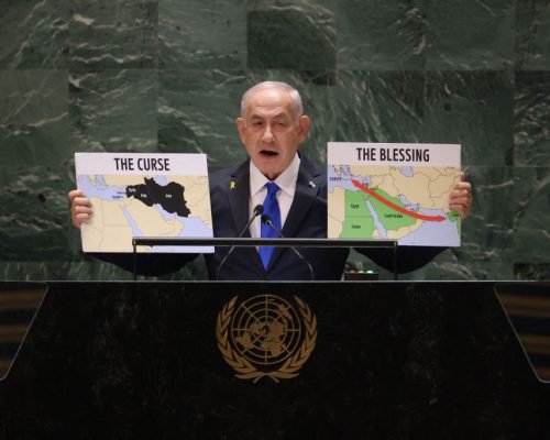 Israeli Prime Minister Benjamin Netanyahu holds maps as he speaks during the 79th Session of the United Nations General Assembly at the United Nations headquarters in New York City on September 27, 2024. Israeli Prime Minister Benjamin Netanyahu said at the UN Friday that operations against Hezbollah will continue, dampening hopes of a 21-day truce proposed by France and the United States this week. (Photo by Charly TRIBALLEAU / AFP) (Photo by CHARLY TRIBALLEAU/AFP via Getty Images)