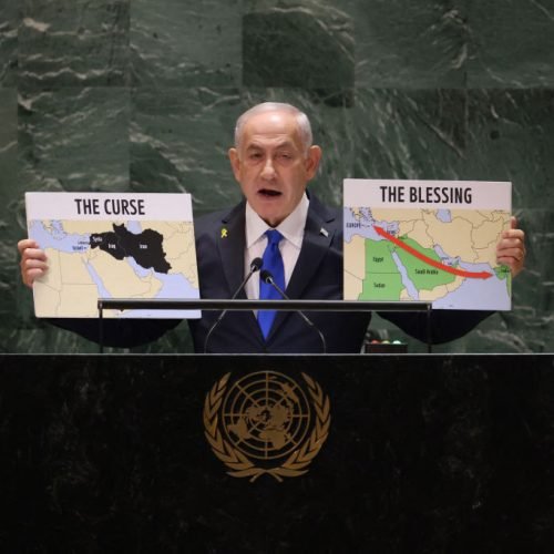 Israeli Prime Minister Benjamin Netanyahu holds maps as he speaks during the 79th Session of the United Nations General Assembly at the United Nations headquarters in New York City on September 27, 2024. Israeli Prime Minister Benjamin Netanyahu said at the UN Friday that operations against Hezbollah will continue, dampening hopes of a 21-day truce proposed by France and the United States this week. (Photo by Charly TRIBALLEAU / AFP) (Photo by CHARLY TRIBALLEAU/AFP via Getty Images)